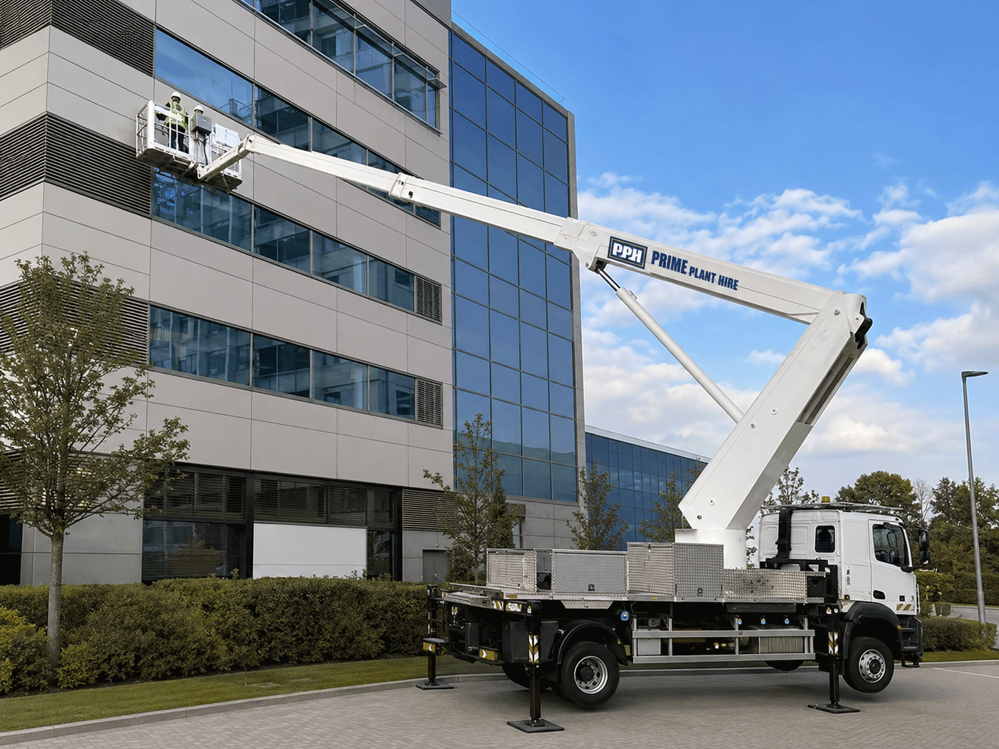 Truck mounted MEWP working on a commercial building facade